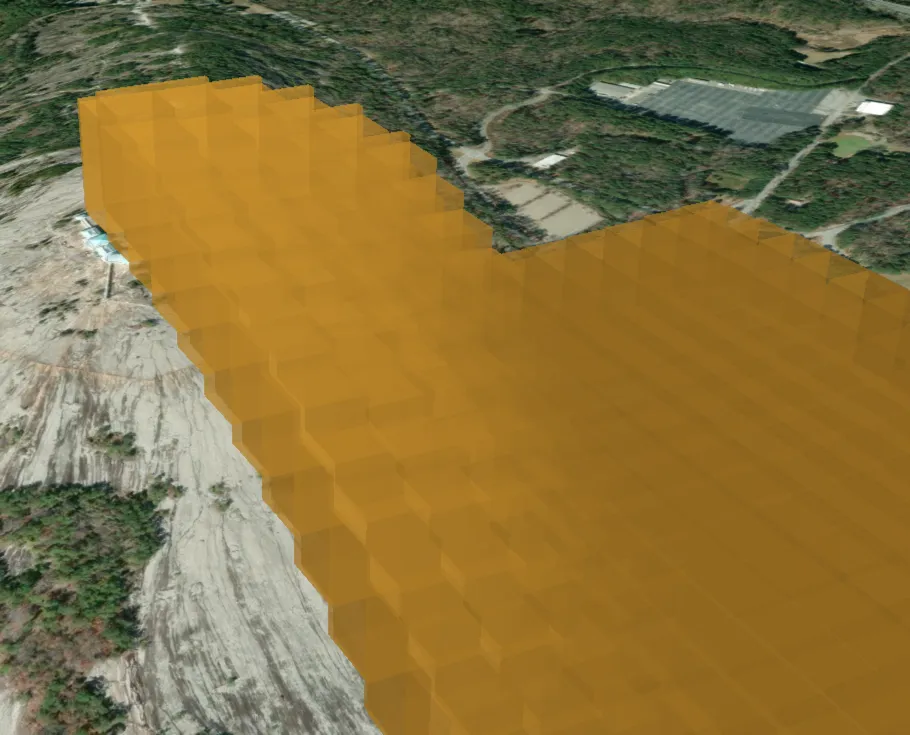 Tessellated airspace over Stone Mountain — hundreds of vertical prisms stepping up and down the mountainside, forming a terrain-following volume